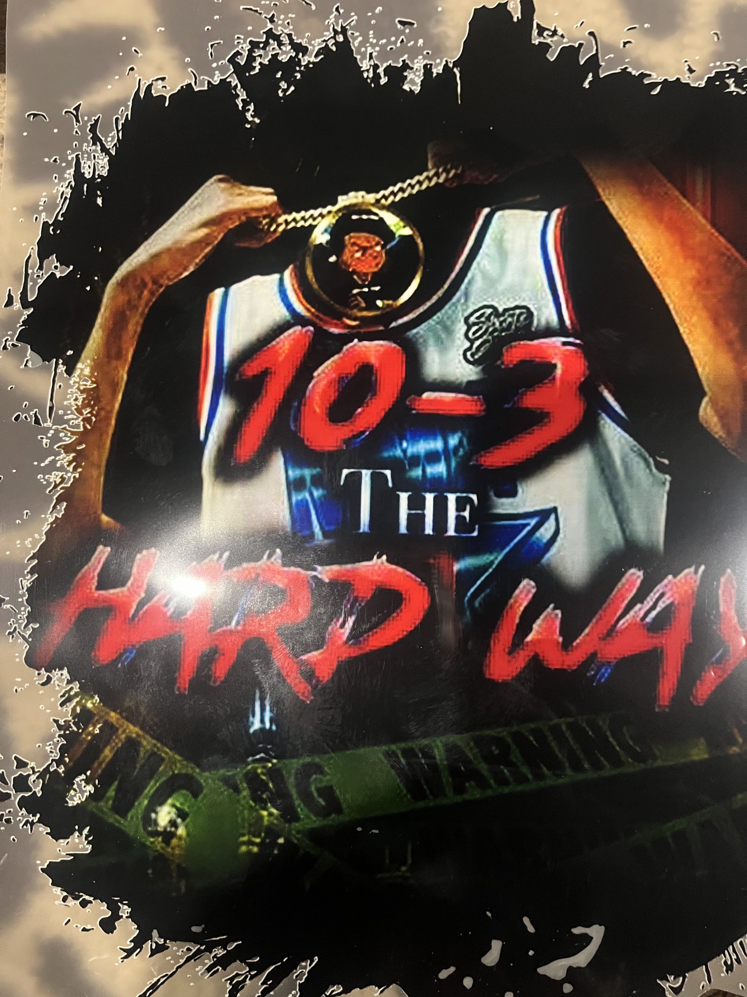 Cover of 10-3 The Hard Way by Jamel Miller — a young man in a basketball jersey holding up a medallion chain