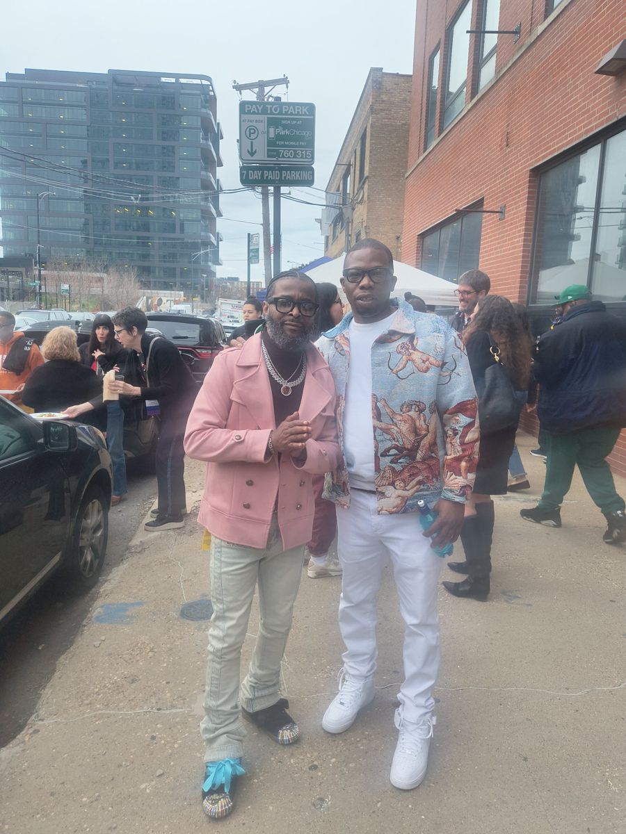Jamel Miller with a friend on a Chicago street during a community gathering