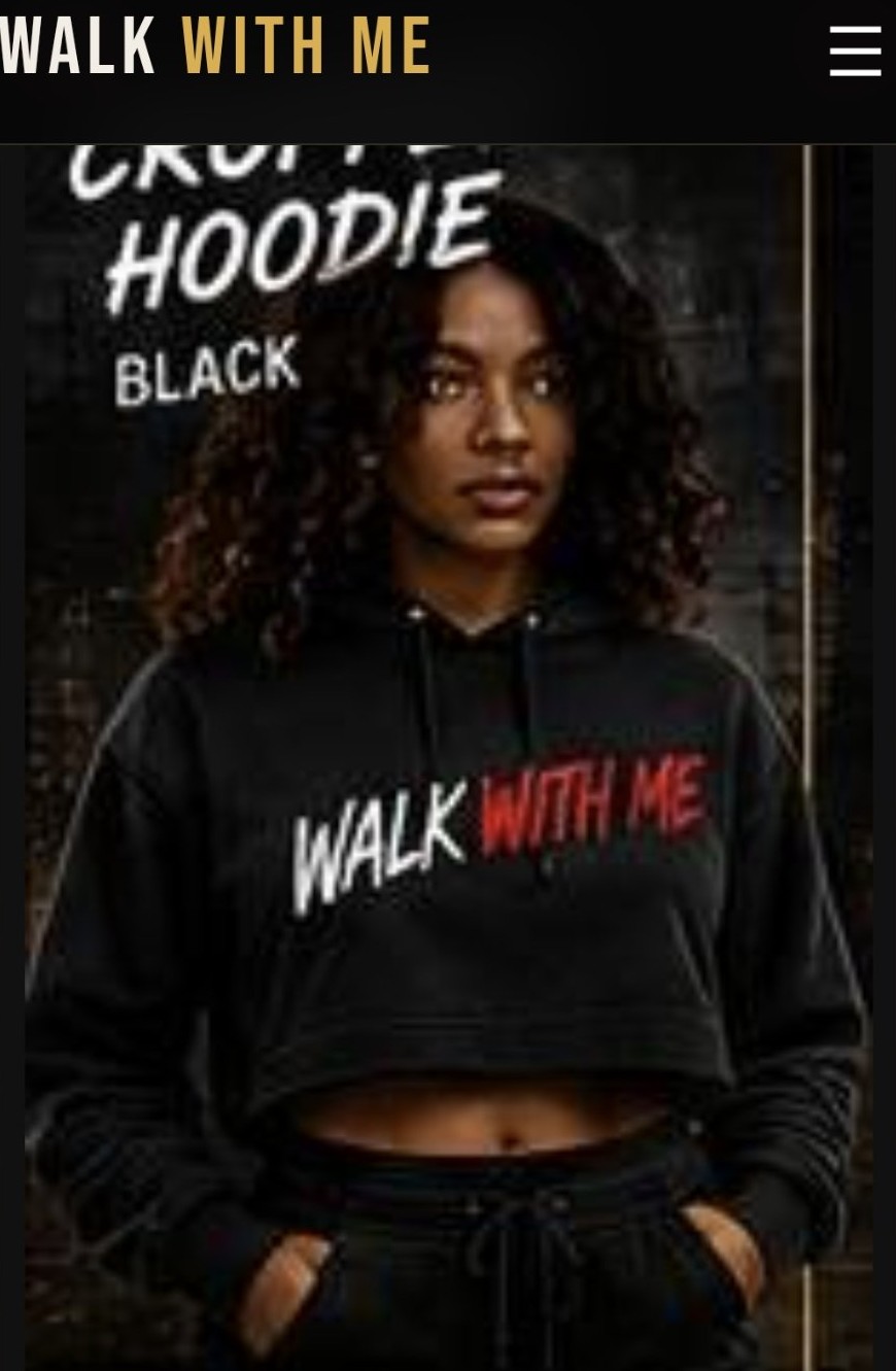 A model wearing the Women's Cropped Hoodie — black cropped hoodie with WALK WITH ME printed across the chest in white and red